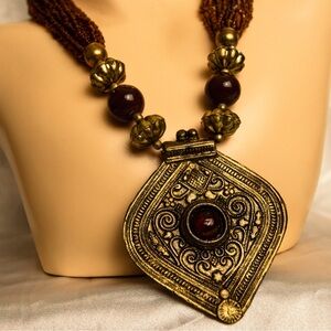 Vintage necklace ancient royalty style jewelry medallion orange toned beads